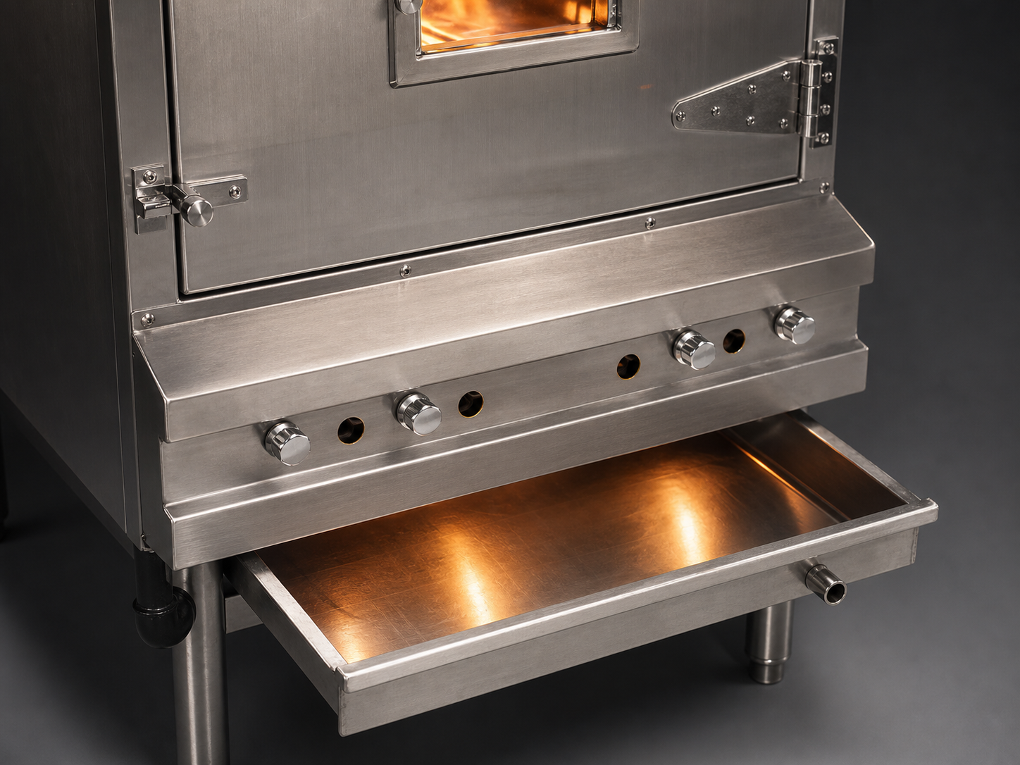 Chinese BBQ oven lower drip tray pulled out for cleaning